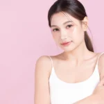 Closeup young asian beautiful woman hand touching arm