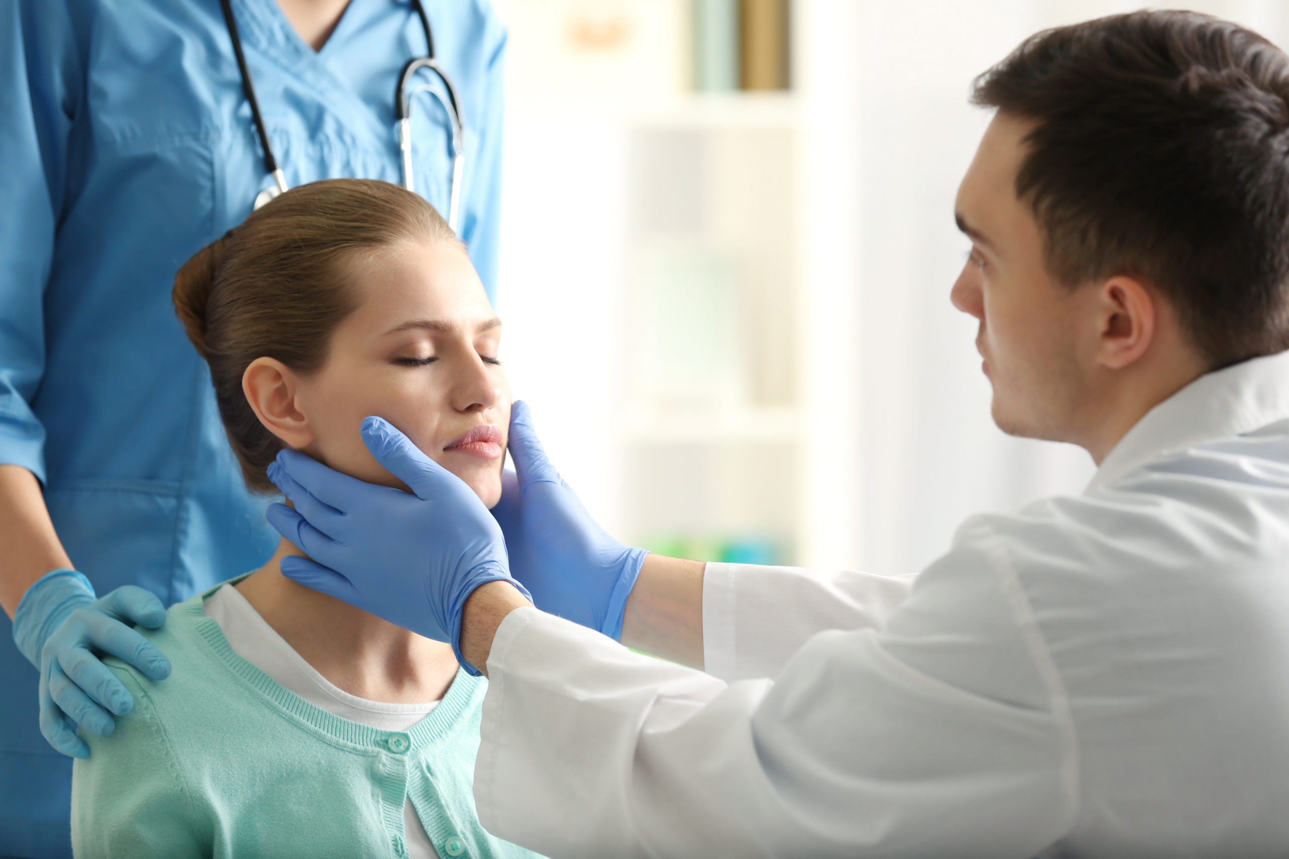 Young woman having meeting with plastic surgeon - Brow Lift