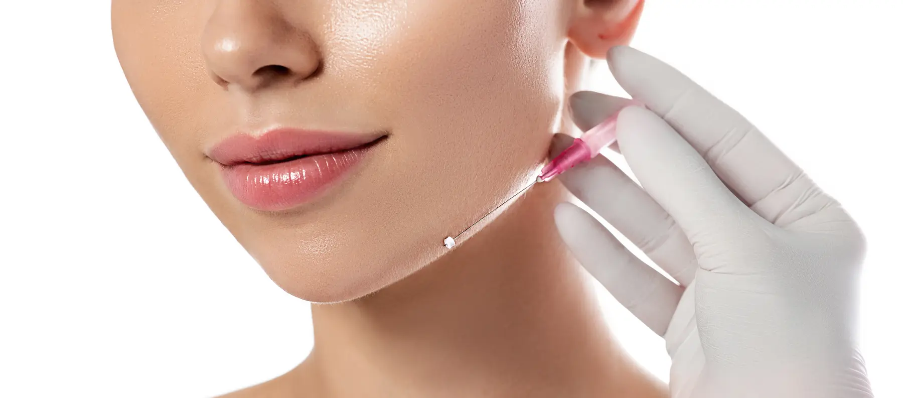 Dermal filler injection on woman's chin for facial contouring.